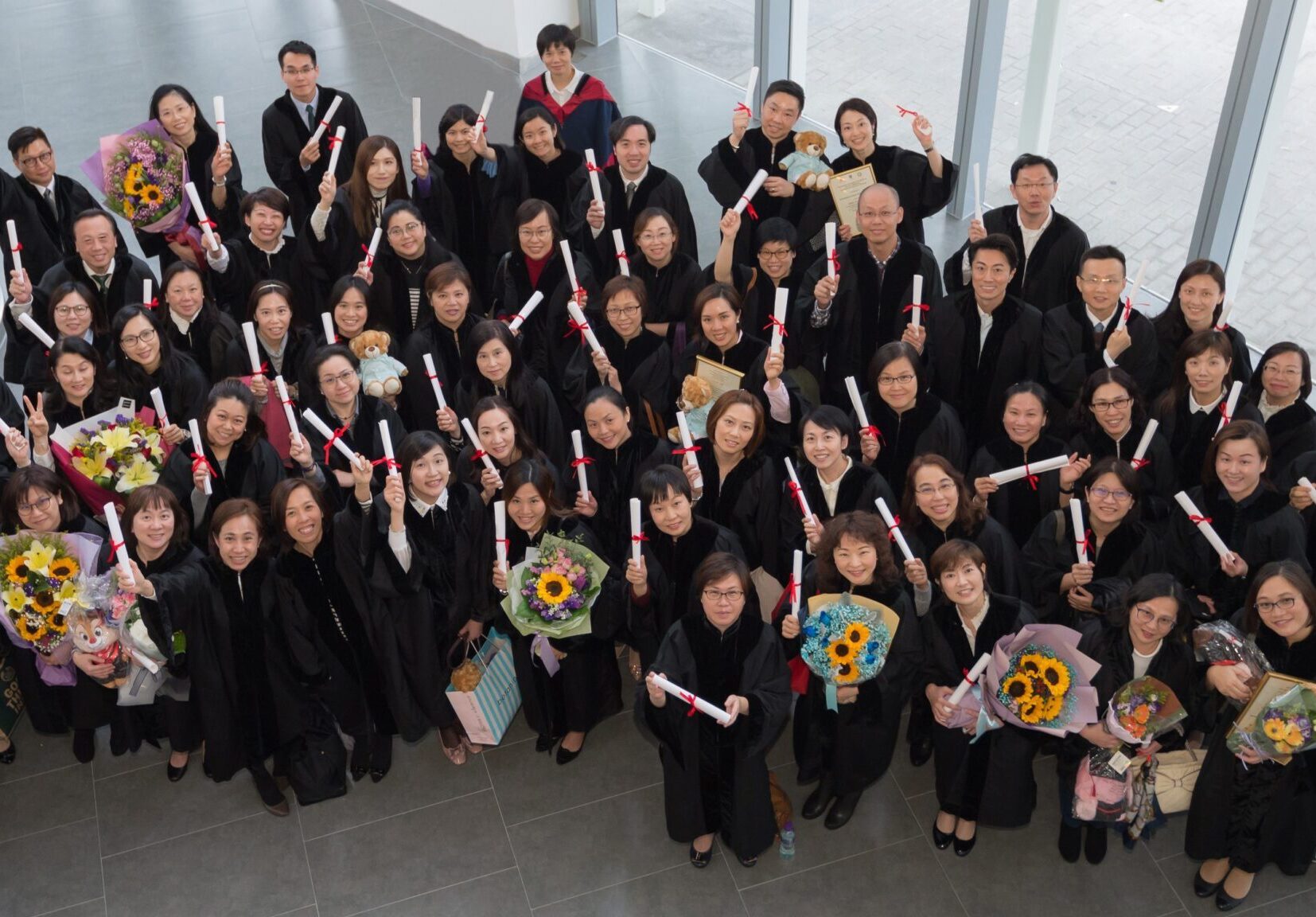 Professional Diploma in Advanced Nursing Practice (PDANP) graduation photo wit certificates and flowers