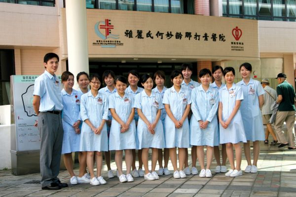 A group of student nurses outside Alice Ho Miu Ling Nethersole Hospital, showing our heritance